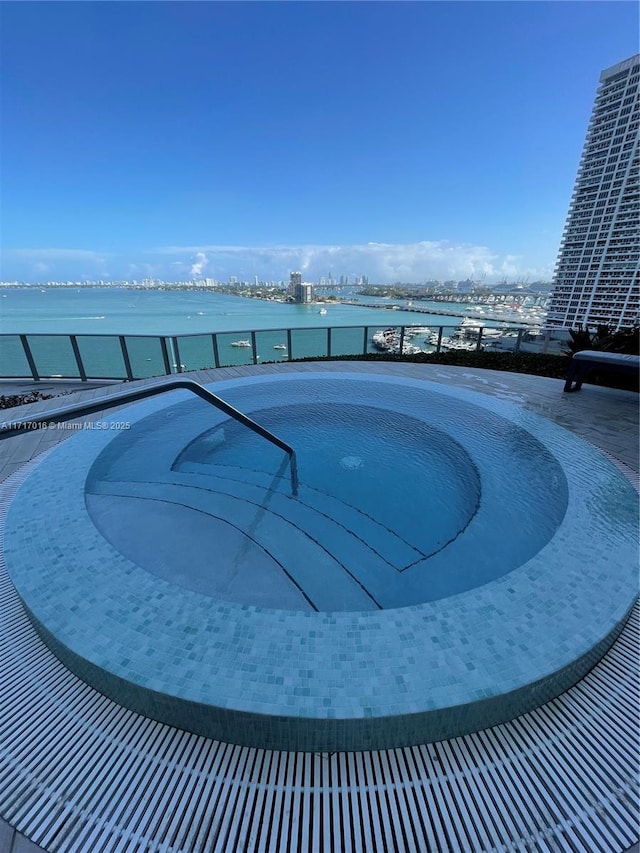 view of pool featuring a water view