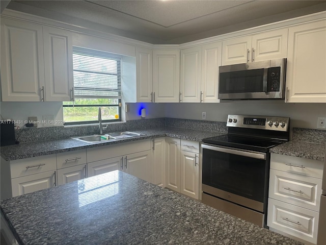 kitchen featuring white cabinetry, sink, and stainless steel appliances