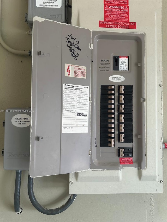 utility room featuring electric panel