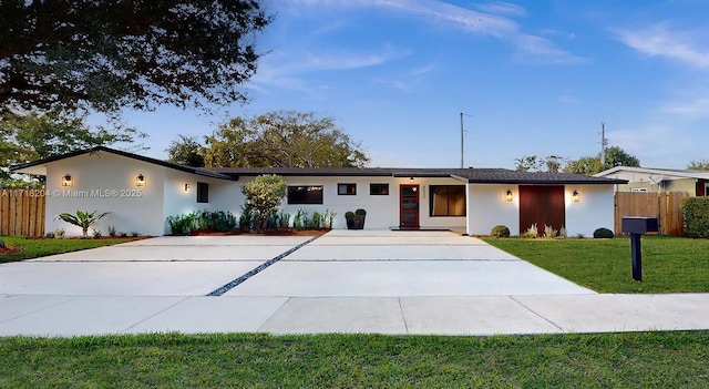 ranch-style house with a front lawn