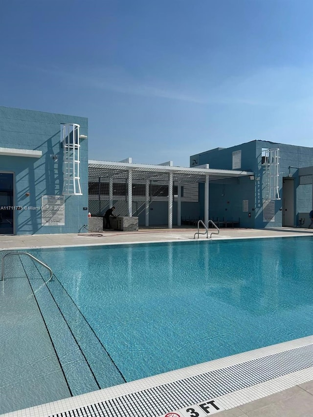 view of pool featuring a patio