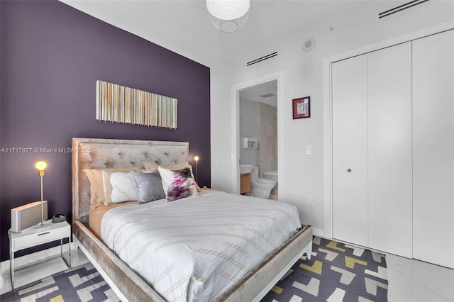 bedroom with visible vents and a closet