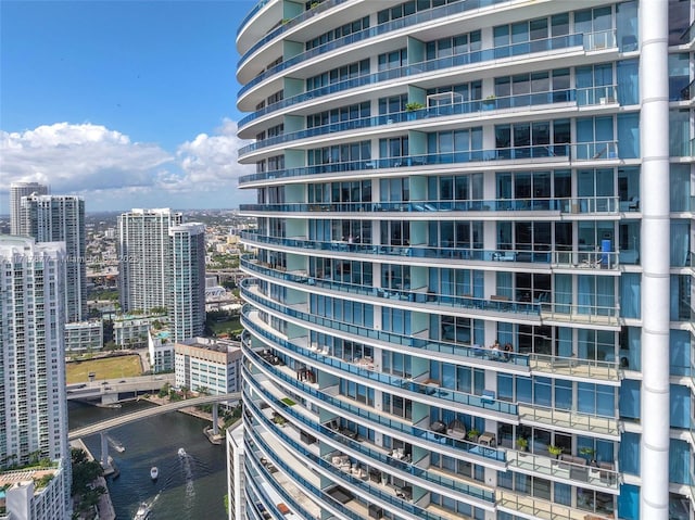 view of property featuring a water view and a city view