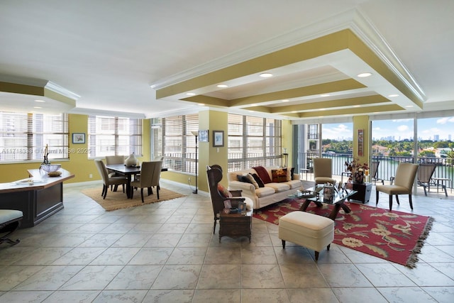 living room with plenty of natural light and ornamental molding