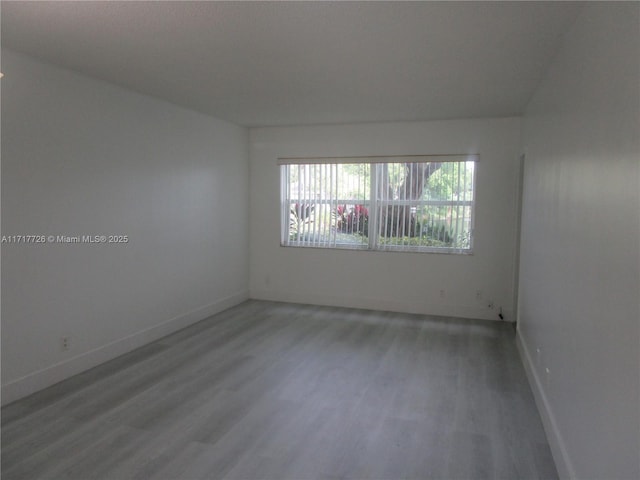 empty room featuring hardwood / wood-style flooring