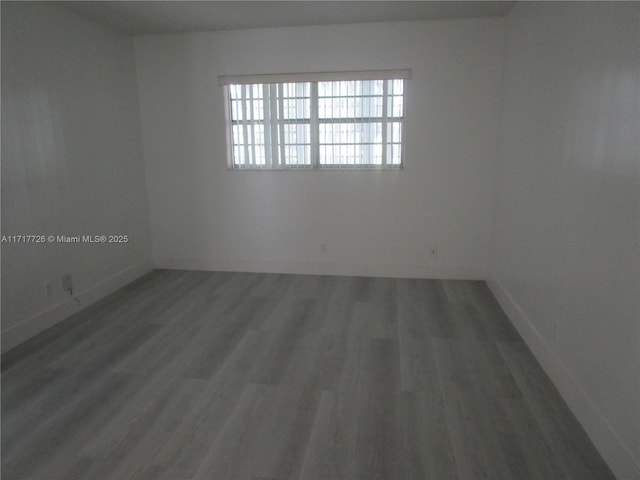 empty room featuring hardwood / wood-style floors