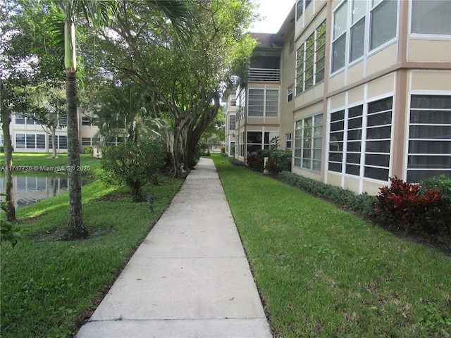 surrounding community featuring a yard