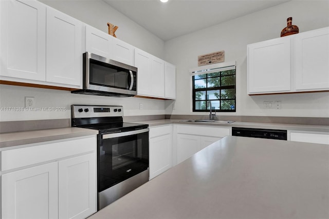 kitchen featuring white cabinets, sink, and stainless steel appliances