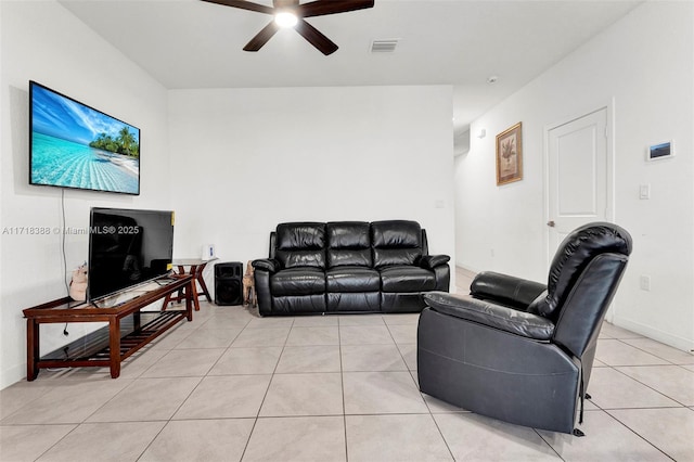 tiled living room featuring ceiling fan