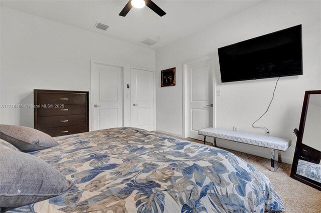 bedroom featuring ceiling fan and carpet floors