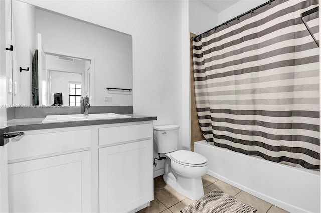 full bathroom featuring tile patterned floors, vanity, toilet, and shower / bathtub combination with curtain