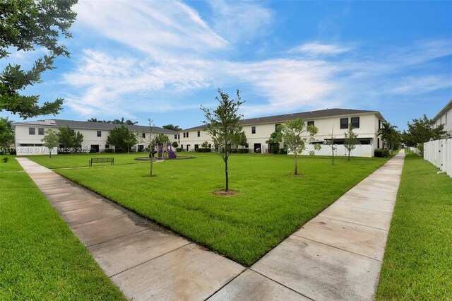 view of home's community with a lawn