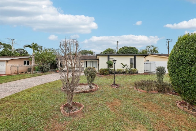 ranch-style home with a front yard