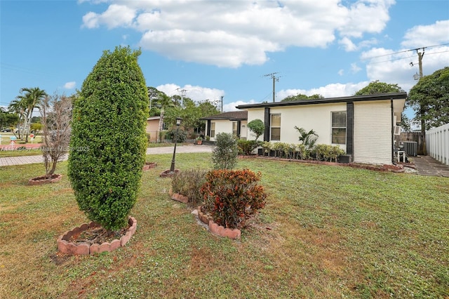 view of yard with central AC