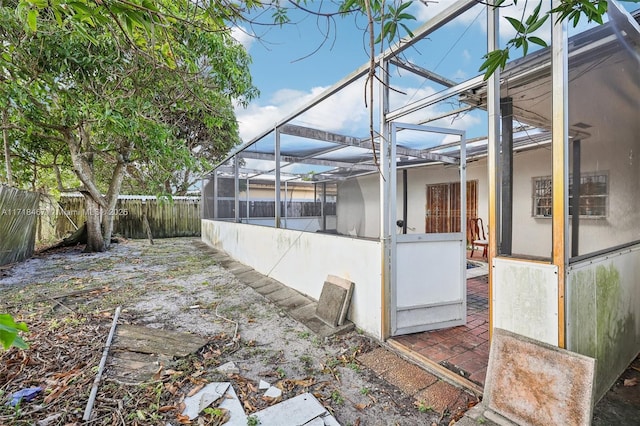 view of patio / terrace with a lanai