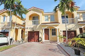 mediterranean / spanish house with a garage