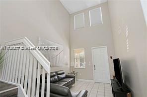 living room with light tile patterned flooring