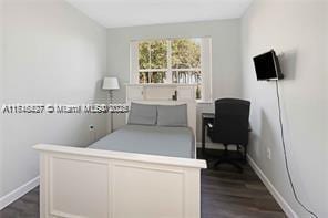 bedroom featuring dark hardwood / wood-style flooring