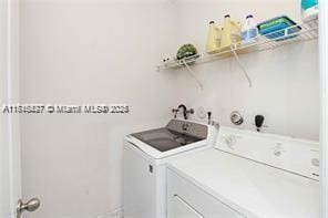 laundry room featuring washer and clothes dryer