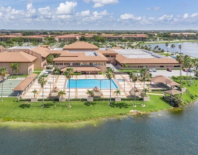 birds eye view of property with a water view