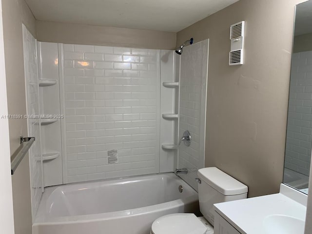 full bathroom featuring vanity, toilet, and tiled shower / bath