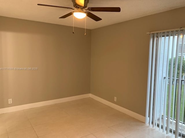 tiled empty room with ceiling fan