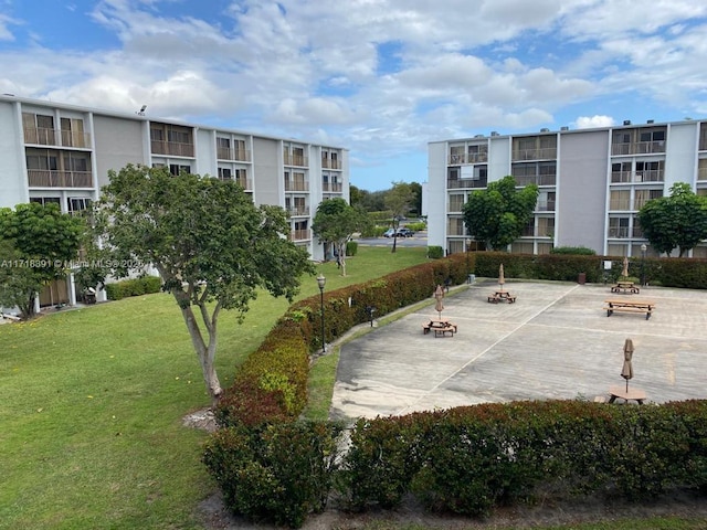 view of home's community with a yard