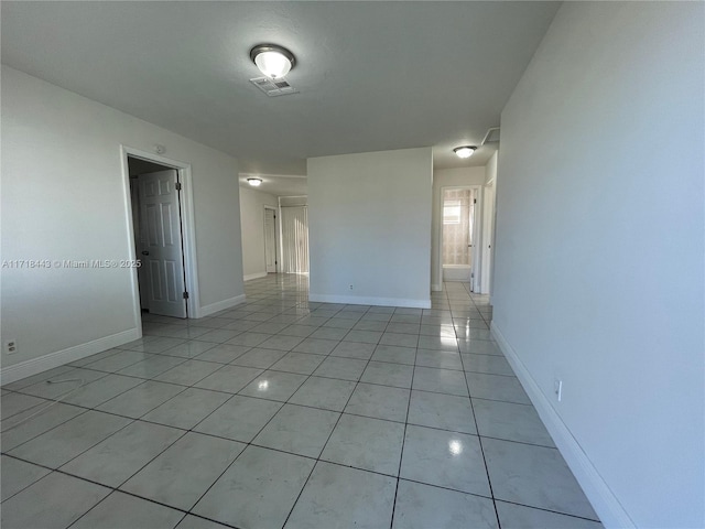 spare room with light tile patterned floors