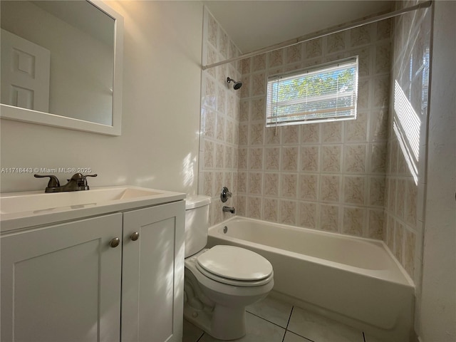 full bathroom with tile patterned flooring, vanity, tiled shower / bath combo, and toilet