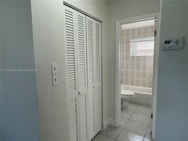 bathroom featuring tile patterned flooring and toilet