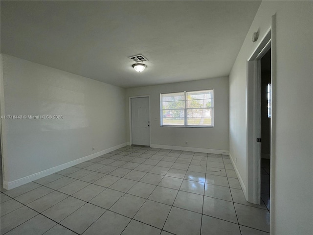 empty room featuring light tile patterned floors