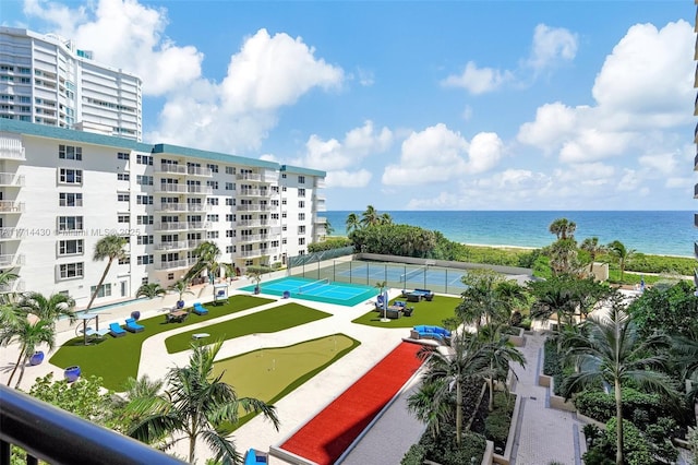 view of swimming pool featuring a water view and tennis court