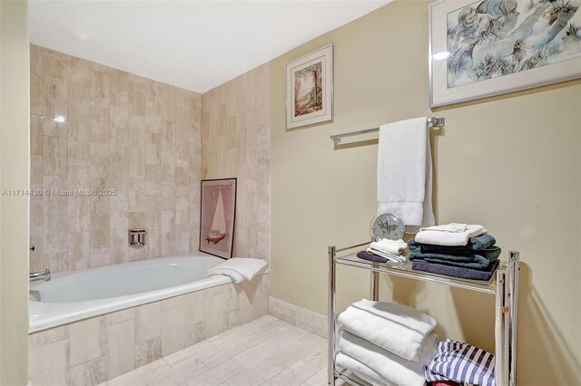 bedroom with light colored carpet and a textured ceiling