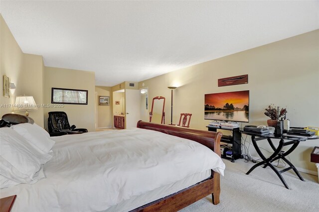 carpeted bedroom with a spacious closet and a closet