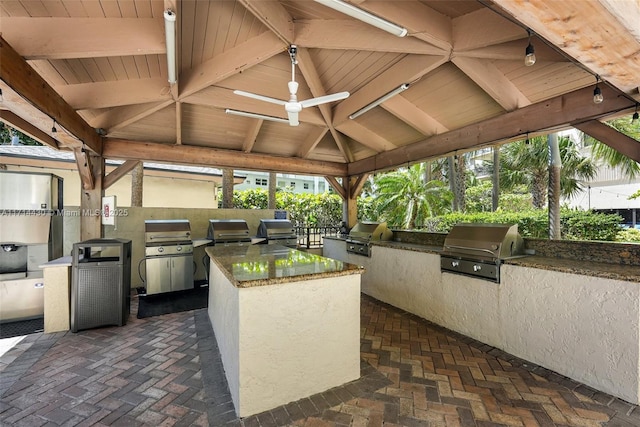 1800 S Ocean Blvd Unit 210, Lauderdale By The Sea, FL 33062 - view of patio / terrace with a gazebo, an outdoor kitchen, ceiling fan, and area for grilling