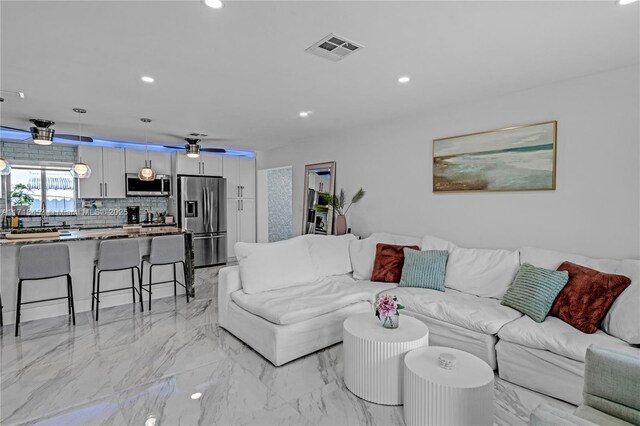 living room featuring ceiling fan