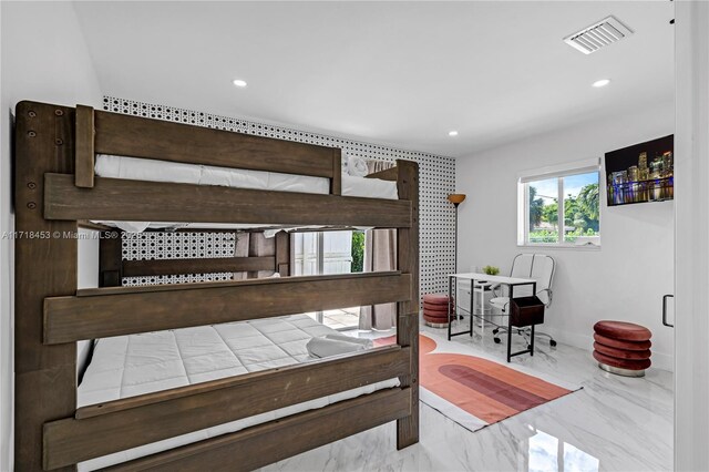 unfurnished bedroom featuring a barn door