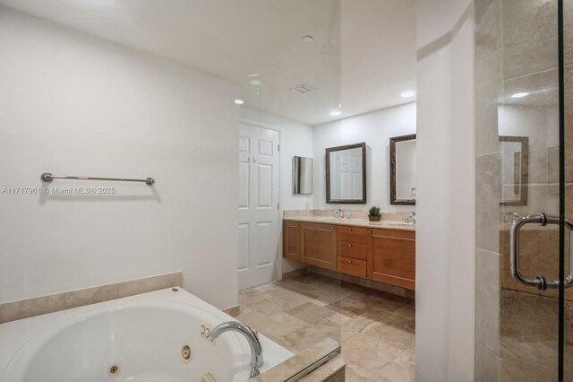 bathroom with separate shower and tub and vanity