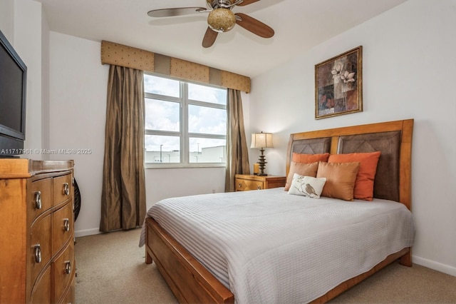 bedroom with light carpet and ceiling fan