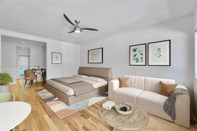 bedroom featuring light wood-type flooring and ceiling fan