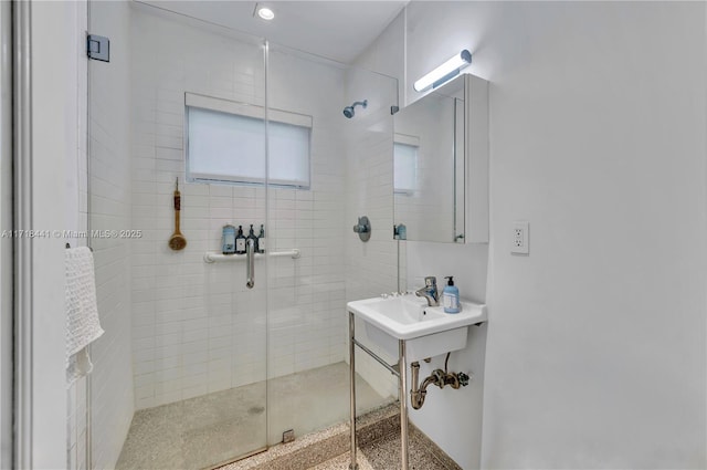 bathroom with a shower with shower door