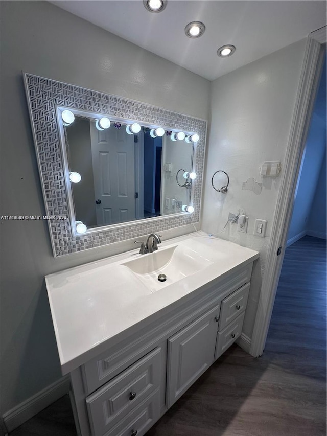 bathroom featuring hardwood / wood-style floors and vanity