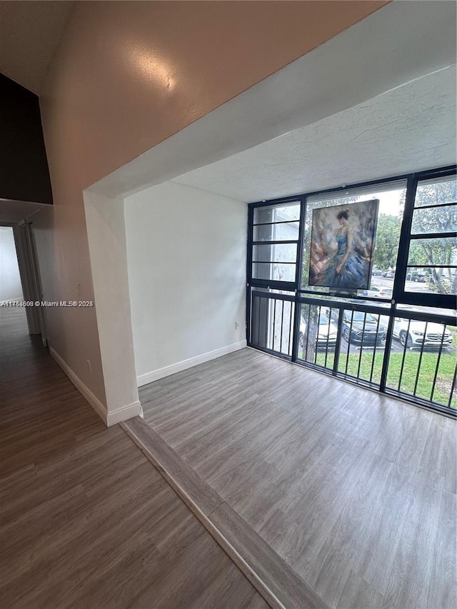 unfurnished room featuring hardwood / wood-style floors