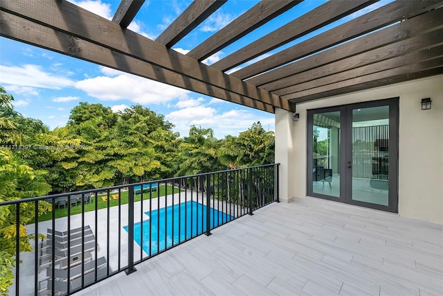 balcony featuring a pergola and a patio area