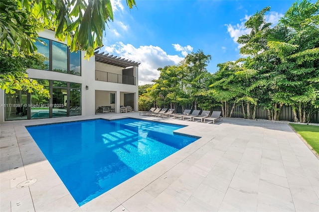 view of swimming pool with a patio area