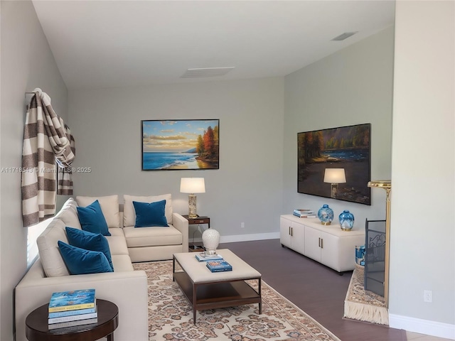 living room with dark hardwood / wood-style flooring