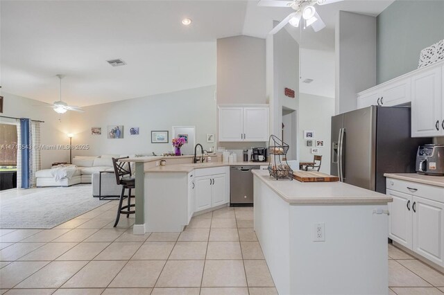 recreation room with ceiling fan and light tile patterned floors