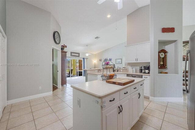 doorway with tile patterned flooring, a wealth of natural light, a notable chandelier, and french doors