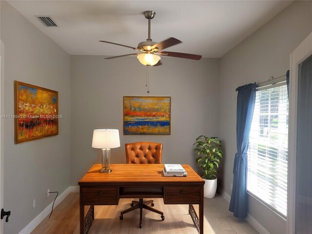 living room featuring light tile patterned floors, ceiling fan with notable chandelier, and high vaulted ceiling