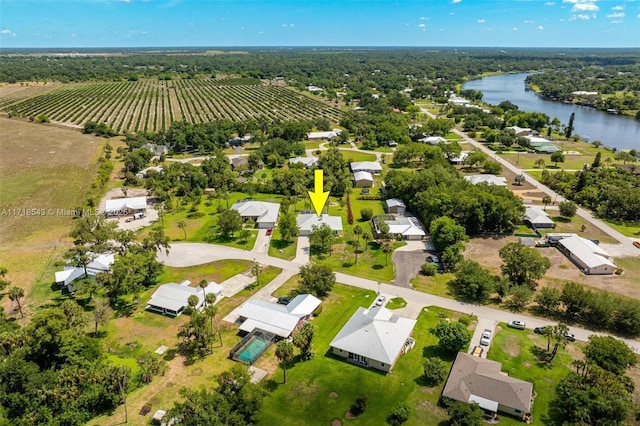 drone / aerial view featuring a rural view and a water view